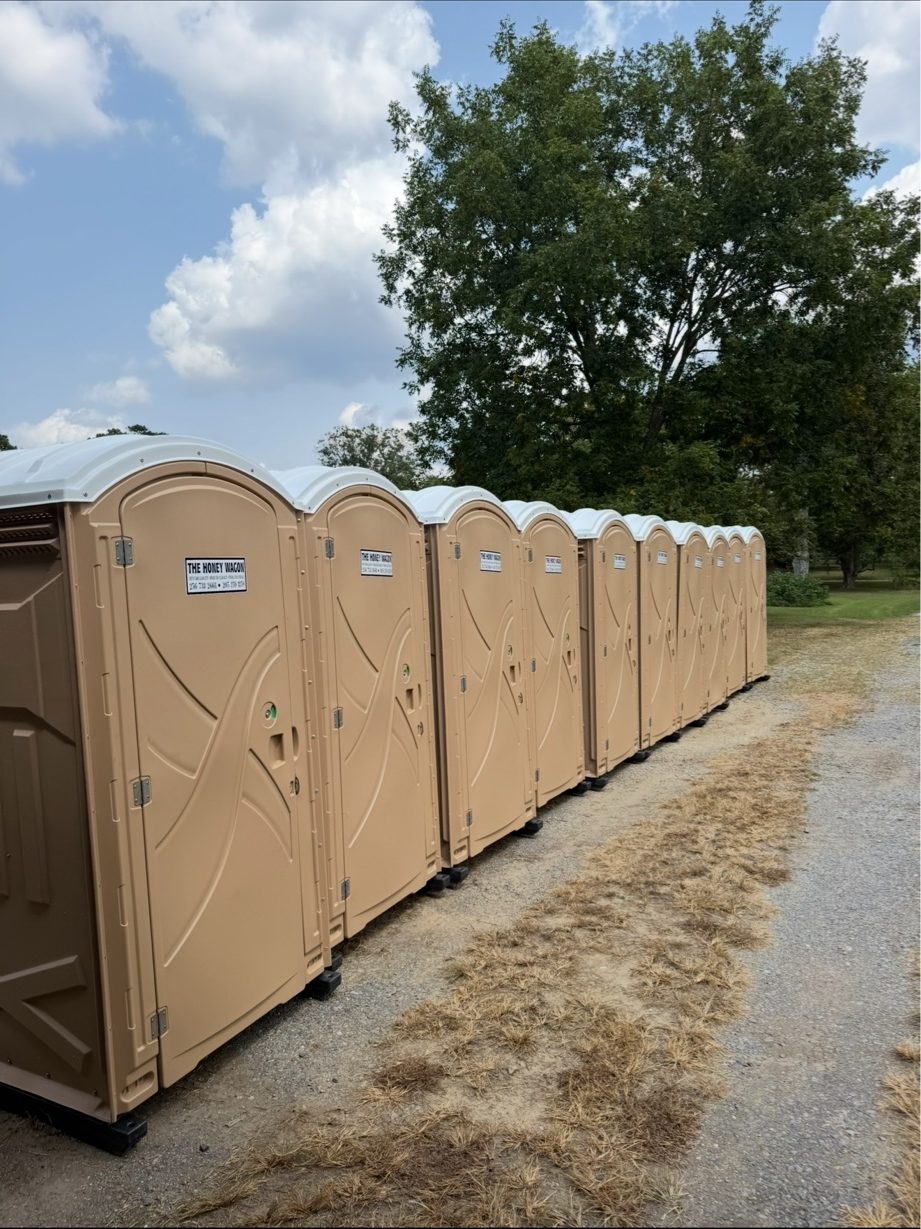 Row of clean Honey Wagon portable restrooms